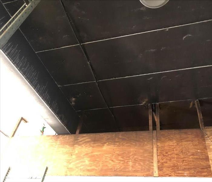 Soot damage to ceiling.